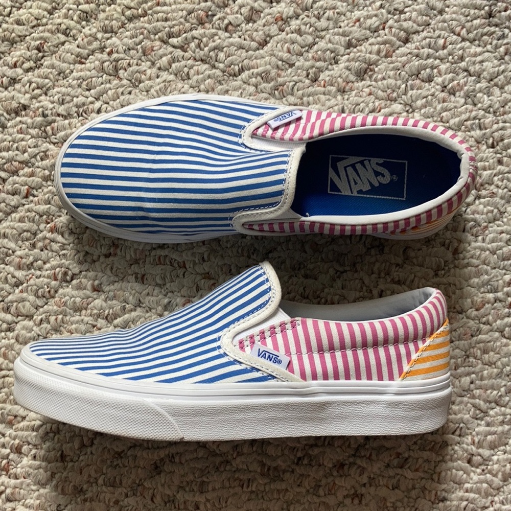 Blue, pink, and yellow pinstriped vans